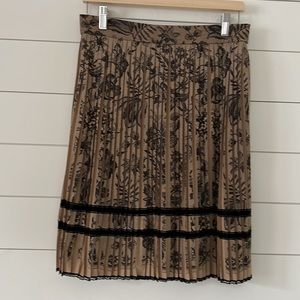 Marc Cain Size N4 ( US10) knife pleated skirt beige with black lacy pattern